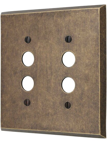 Traditional Forged Brass Double Gang Push Button Switch Plate in Antique Brass.